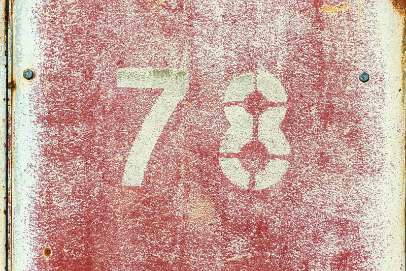 Number 78 on vintage rusty red and white metal sheet plate Prague, Czech republic