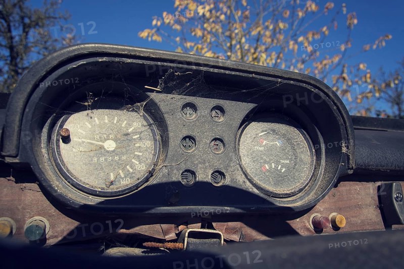 Filtered vintage photo of rusty speedometer on car control panel on sunny day Prague Czech republic
