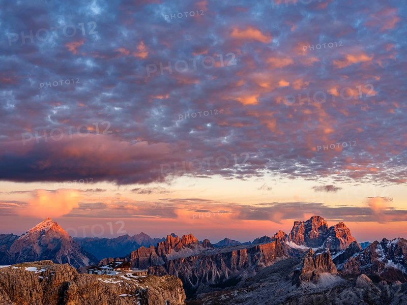 Alpenglühen, Rifugio Lagazuoi and rugged Dolomite peaks at sunset, Dolomites, Alps, Belluno province, Veneto, Italy