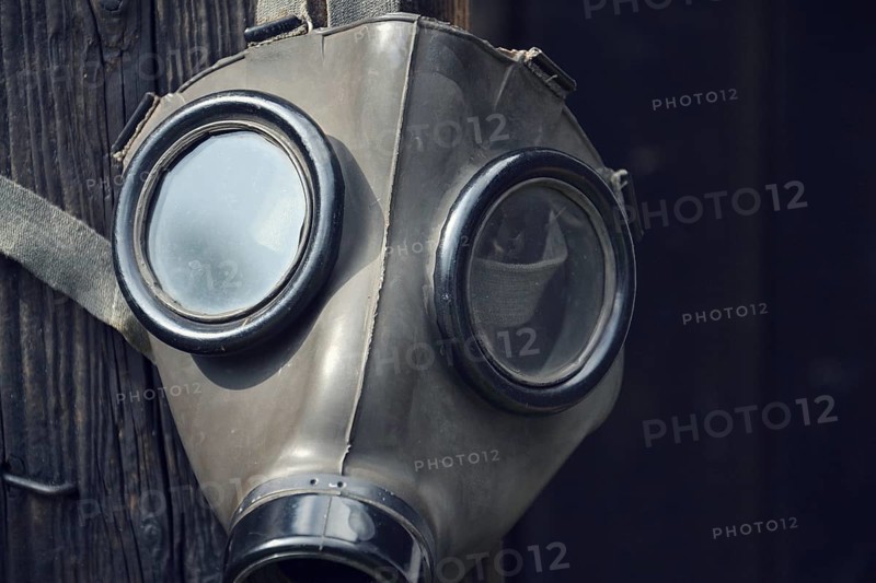 Closeup of a gas mask on a wooden background