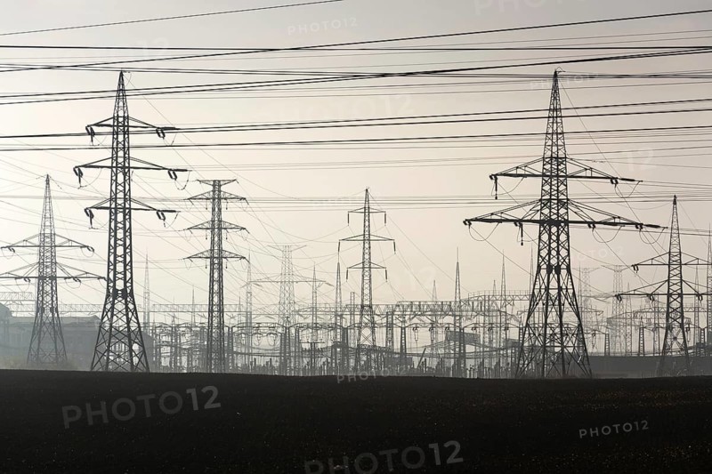 Electricity pylons leading from distribution power station Prague Czech republic