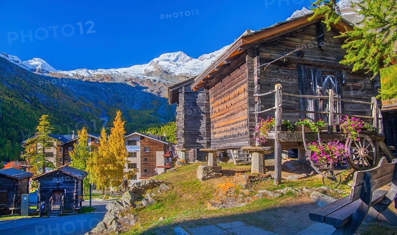 Typical granaries on the outskirts of the village with Allalin 4027m and Alphubel 4206m in autumn, Saas-Fee, Saasertal, Valais, Switzerland
