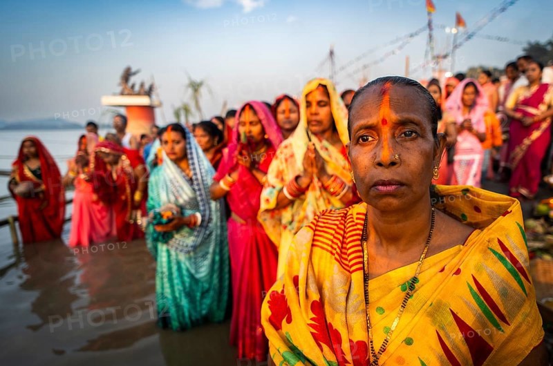 Hindu devotees offer prayers to the Sun God on the bank of Brahmaputra river on the occasion of Chhath Puja, in Guwahati, India on 27 October 2025