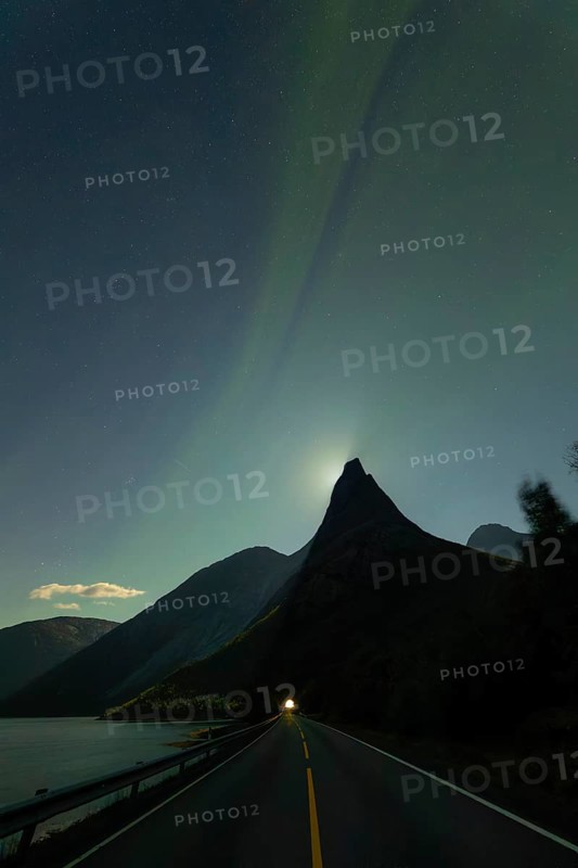 National mountain of Norway - Stetind in the Nordland under auroras and a full moon