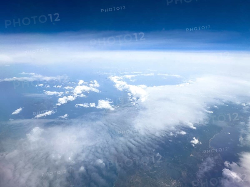 View from airplane of white bright cluster clouds Cirrus cirrus clouds, international
