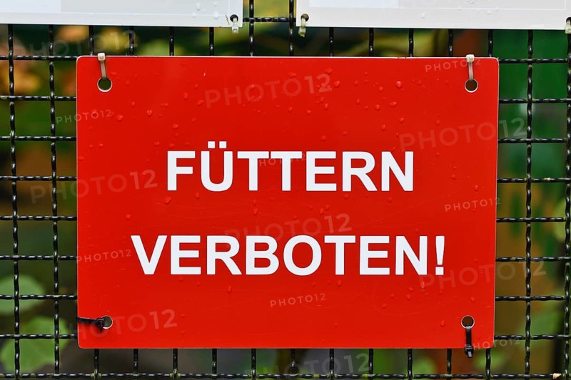 German Do not feed sign at zoo or animal enclosure, warning for visitors and wildlife protection