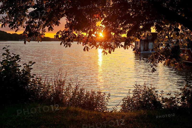 Atmospheric sunset over Lake Gudelack, Lindow (Mark), Stechlin-Ruppiner Land nature park Park, Brandenburg, Germany