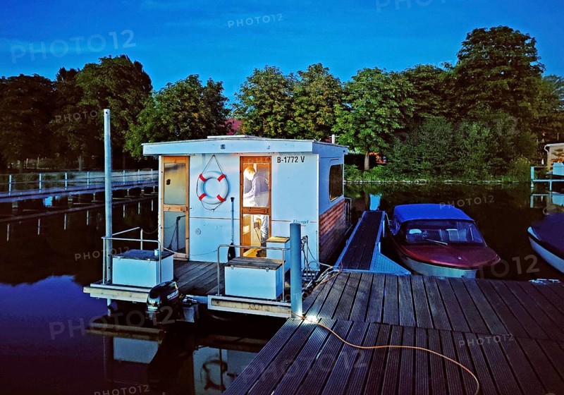 Houseboat at dusk at Marina Lindow (Mark), Gudelacksee, Stechlin-Ruppiner Land nature park Park, Brandenburg, Germany