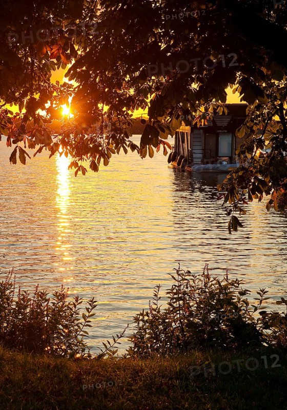Atmospheric sunset over Lake Gudelack, Lindow (Mark), Stechlin-Ruppiner Land nature park Park, Brandenburg, Germany