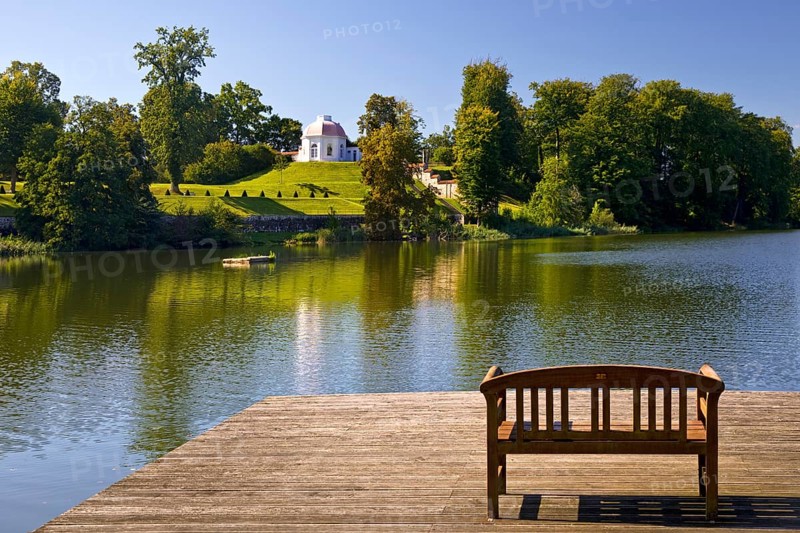 Footbridge with bench to Huwenowsee at Meseberg Castle Park, guest house and conference venue of the Federal Government, Gransee, Brandenburg, Germany