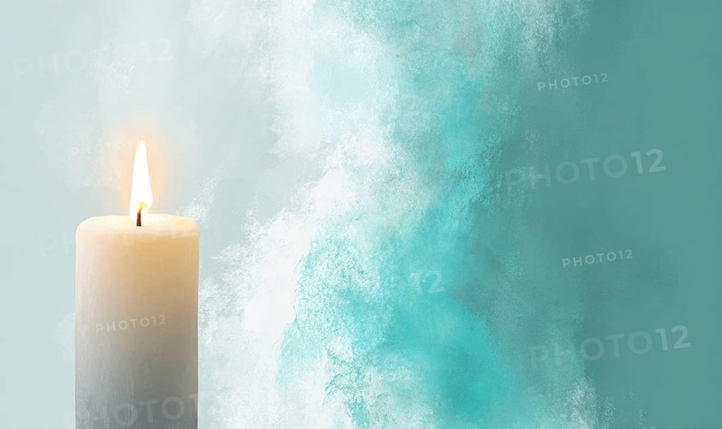 A candle is lit in front of a blue background. The candle is the main focus of the image, and it creates a warm and cozy atmosphere. AI generated