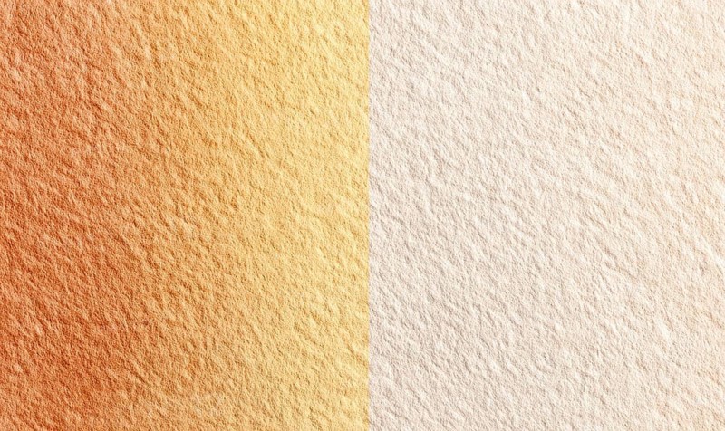 Two tan and white surfaces with a slight orange hue. The surfaces are slightly textured and appear to be a part of a larger, more complex design. AI generated