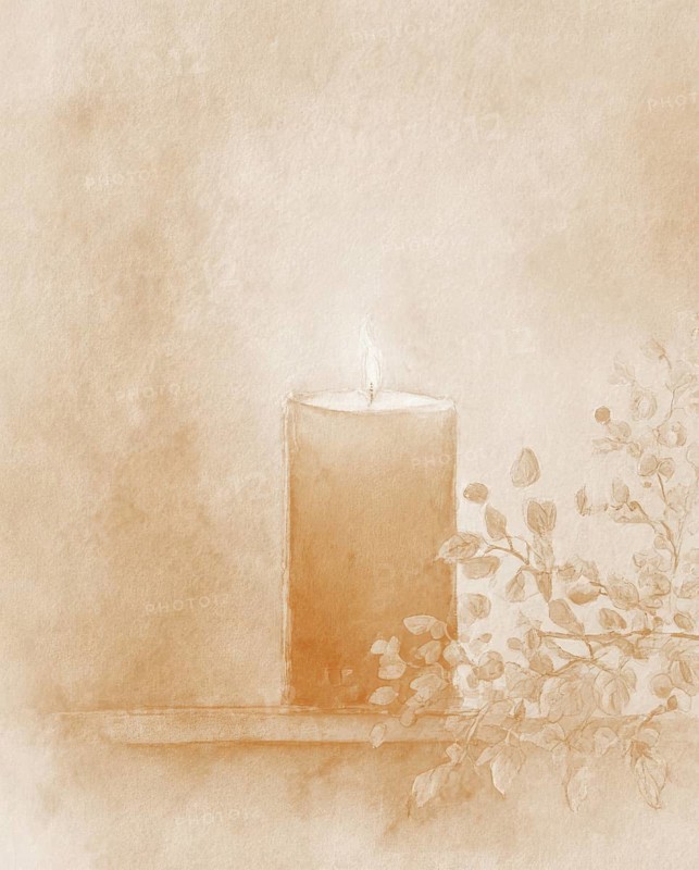 A candle is lit on a table with some leaves. The candle is orange and the leaves are green. AI generated