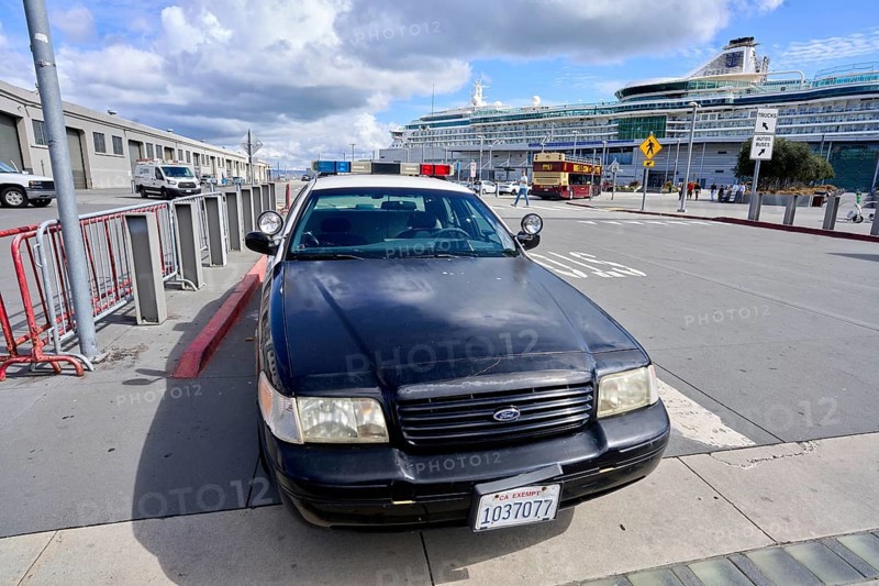 Police vehicle in front of a cruise ship near Fisherman's Wharf in San Francisco