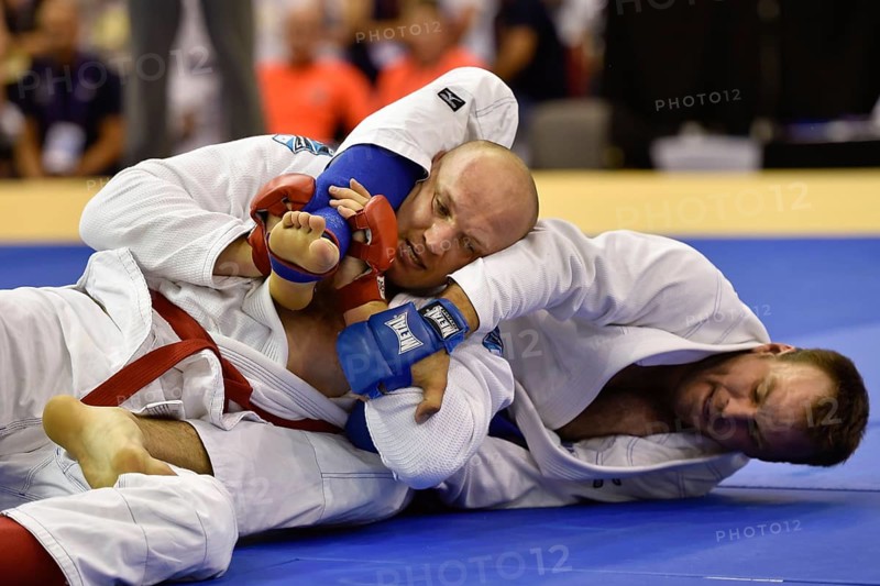 WROCLAW, POLAND - JULY 29, 2017: Ju-Jitsu Fighting tournament during the The World Games 2017. Final fight between Rafal Riss POL (red) vs Alexandre Fromange FRA (blue)