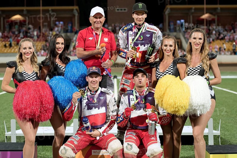 WROCLAW, POLAND - JULY 29, 2017: Speedway couple turnament race Poland - Australia during The World Games 2017. Decoration of gold medalist, from left Marek Cieslak (manager), Patryk Dudek (20), Maciej Janowski (12) and Bartosz Zmarzlik (11)
