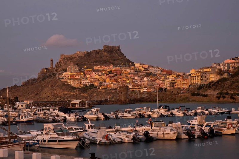 CASTELSARDO, ITALY - AUGUST 20, 2017: Aerial view of boats in port and city Castelsardo, one of the most beautiful city in Sardinia, Italy