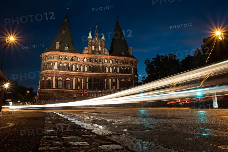 LUBECK, GERMANY - AUGUST 3, 2016: Holstentor Gate during twilight. Lubeck is the 2nd largest city in Schleswig-Holstein region. Its old town is on a UNESCO World Heritage Site