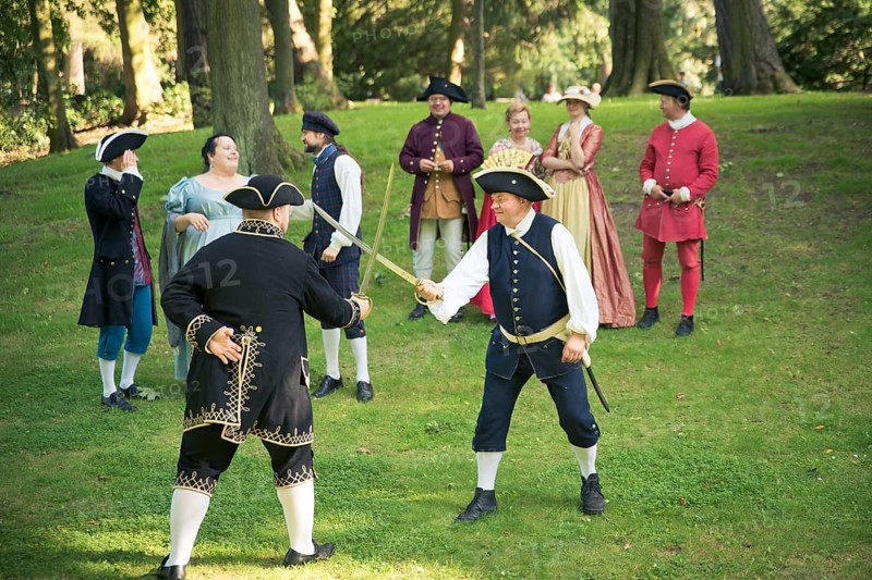 GDANSK, POLAND - August 15, 2017: Two men are fighting by the swords, during historical staging in the Oliwa Park