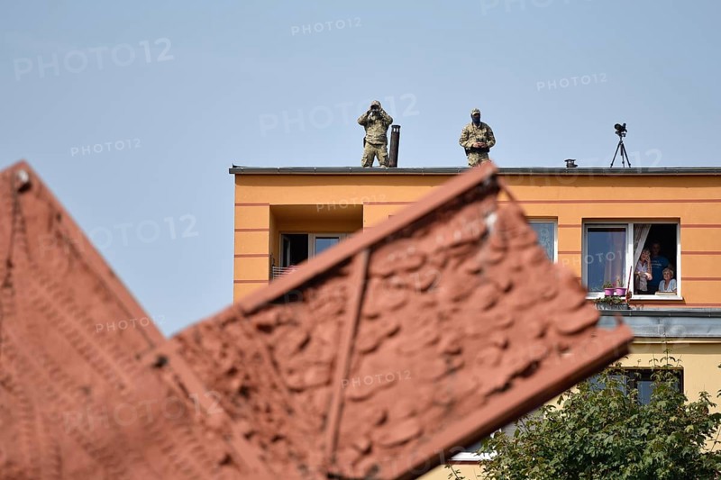 LUBIN, POLAND - AUGUST 31, 2017: Celebrations of the 35th anniversary of the Lubin Crime and the 37th anniversary of the founding Solidarnosc. Soldiers with binoculars on the top of the building