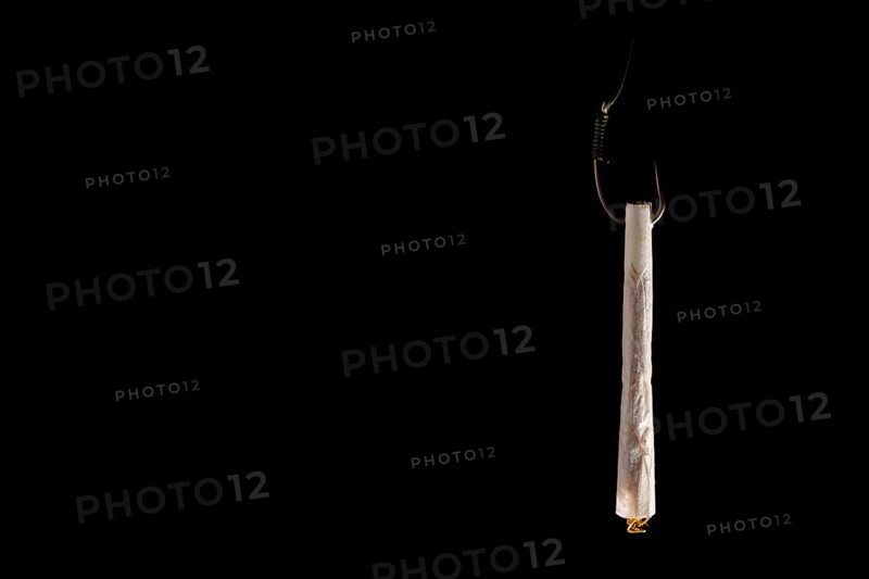 Marijuana joint baiting a fishing hook, representing addiction, dependence, and the lure of drug abuse