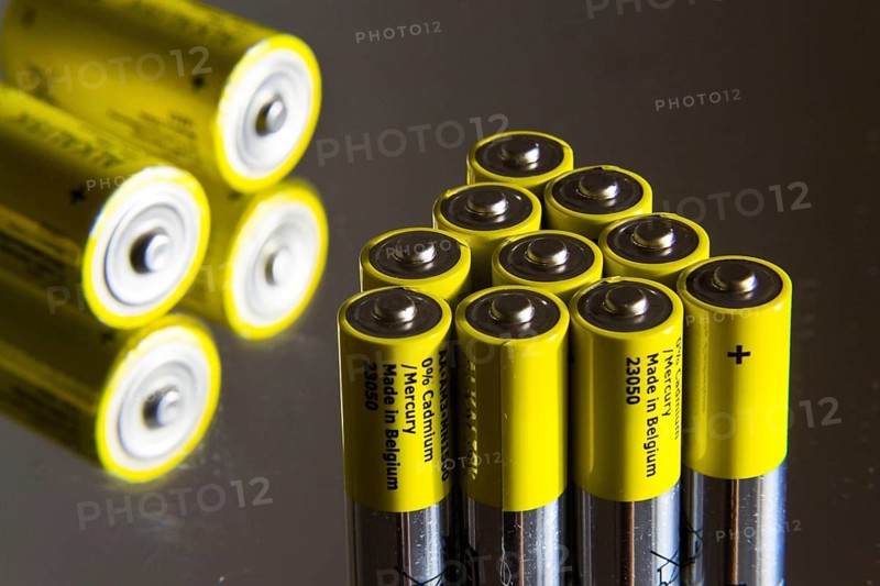 Stack of yellow AA batteries close up, electricity storage concept Prague, Czech republic