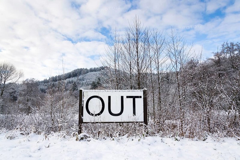 Out sign in snowy landscape, New Years Resolutions, self-improvement concept, lifestyle change, mind-body improvement Prague Czech republic