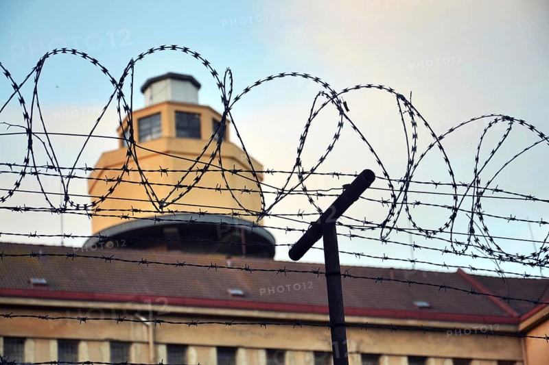 Barbed wire fence layed around prison walls Prague Czech republic