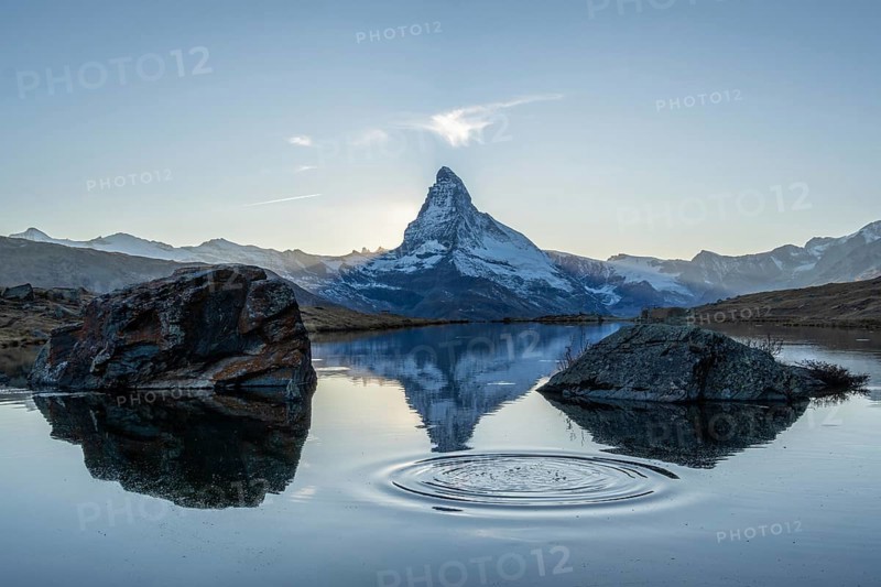 Matterhorn Mountain and Reflection in Lake Stellisee in Evening. Ripples in Circles. Swiss Alps. Valais, Switzerland