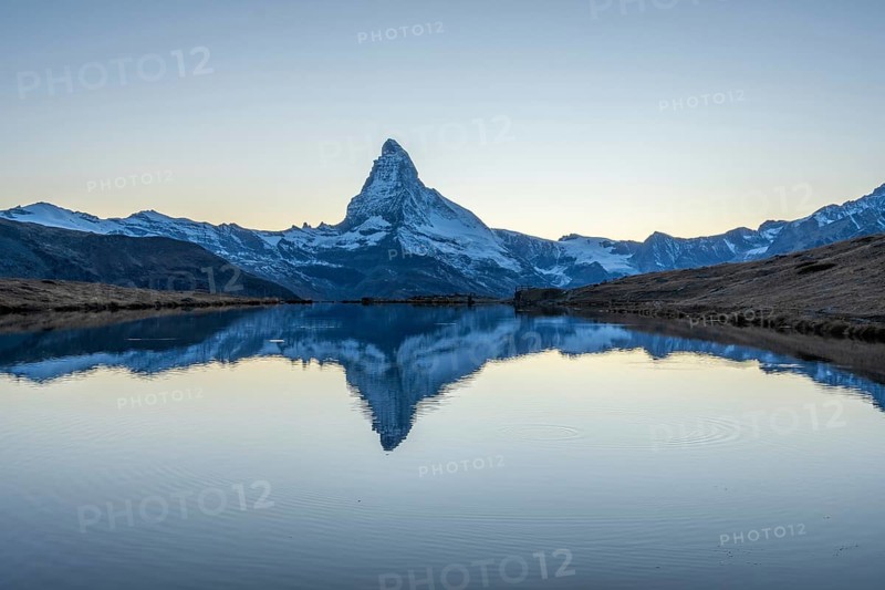 Matterhorn Mountain and Reflection in Lake Stellisee in Evening Twilight. Swiss Alps. Valais, Switzerland