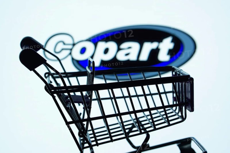 Dhaka, Bangladesh- 03 July 2025: Silhouette of a shopping cart in front of the Copart logo, symbolizing ecommerce and online shopping