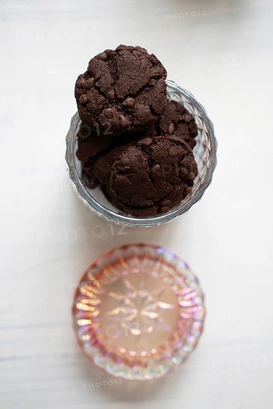 Chocolate chip cookies in a glass cookie jar