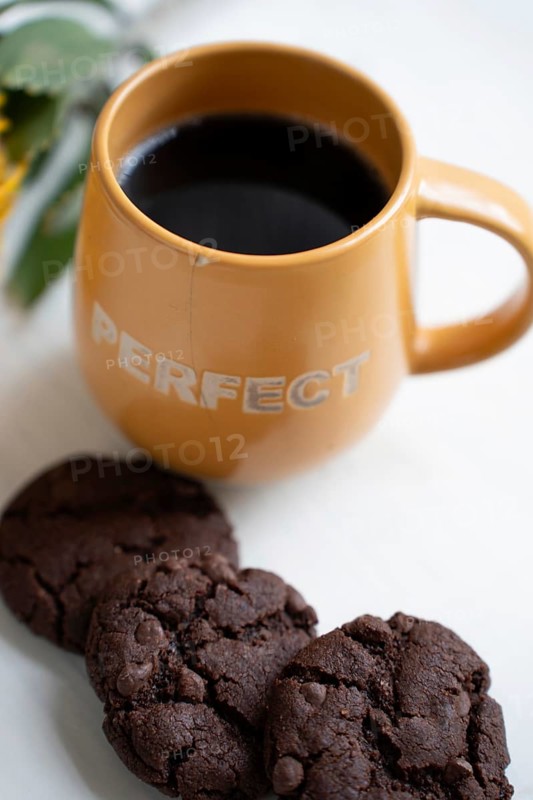 Chocolate chip cookies with a cup of black coffee