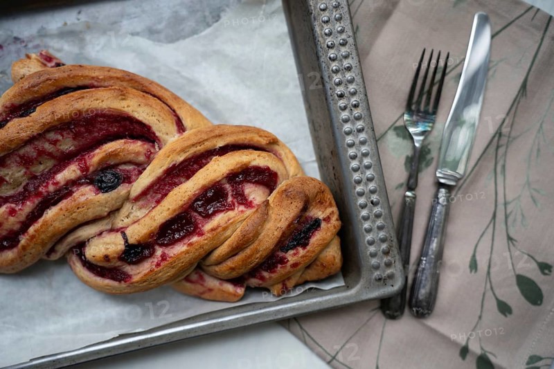 Marmalade strudel on an antique baking tray