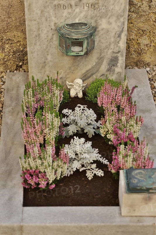 Children's grave with angel figure and beautiful flower decoration for All Saints on a cemetery wall, Upper Bavaria, Bavaria, Germany