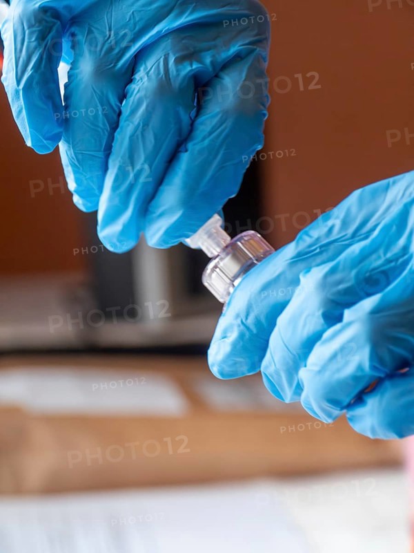 Istambul, Turkey October 21st 2025 Nurse hands in blue gloves preparing Sandostatin Anti growth hormone injection for patient treatment by Novartis