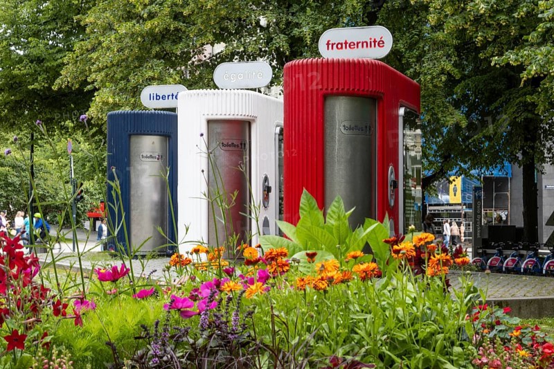 Public toilets on Karl Johans gate in central Oslo, painted in the three colours of the French flag and bearing the three main slogans of the French Revolution – Liberté, Égalité, Fraternité or Liberty, Equality, Fraternity. Oslo, Østlandet, Norway