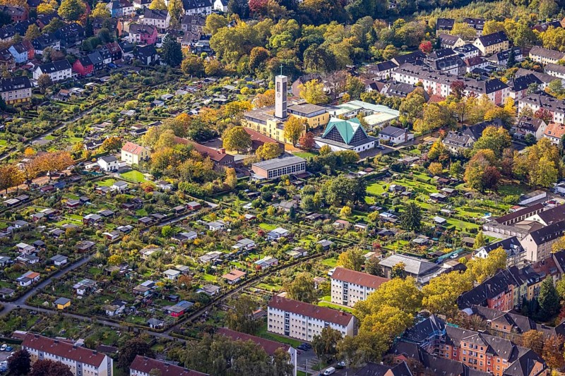 Aerial view, allotment gardener association Essen West e.V. and Evangelical St. Mark's Church, autumn trees, Frohnhausen, Essen, Ruhr area, North Rhine-Westphalia, Germany, place of worship, religious community, church, holy place, KGV, church, parish, allotment garden, allotment garden, allotment garden association, allotment garden association, confession, arbor colony, aerial photo, aerial photography, aerial photography, religion, religious place, allotment garden, overview, bird's eye view, birds-eyes view, overview