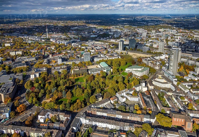 Aerial view, Essen Aalto Theatre and Essen Philharmonic in the Stadtgarten, Essen Campus construction site, telecommunications tower Telekom, view of the city, Südviertel, Essen, Ruhr area, North Rhine-Westphalia, Germany, trees in autumn colors, DE, Europe, events, autumn colors, autumn colors, autumn atmosphere, culture, art, aerial photography, aerial photography, theatre, overview, venue, birds-eyes view, autumnal tree-lined avenue, autumn trees, cultural use, overview