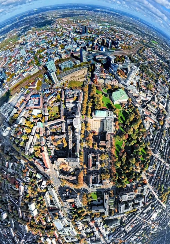 Aerial view, central station station, redesign of Essen campus construction site and planned new building for office campus, Aalto Theatre Essen and Philharmonic Essen with city garden, view of the city, globe, fisheye shot, 360 degree view, tiny world, little planet, fisheye picture, Südviertel, Essen, Ruhr area, North Rhine-Westphalia, Germany, railway station, construction area, building land, building plots, construction project, construction site, city, DE, Deutsche Bahn AG, Europe, events, fisheye lens, track systems, tracks, large construction site, Central Station, Central Station, City Center View, Culture, Art, Little Planet, Aerial View, Aerial Photography, New Building, City Center, City Center, Super Wide Angle Lens, Theatre, Tiny World, Overview, Venue, Birds-Eyes View, Fisheye Lens, Insta360 Camera, Cultural Use, Overview