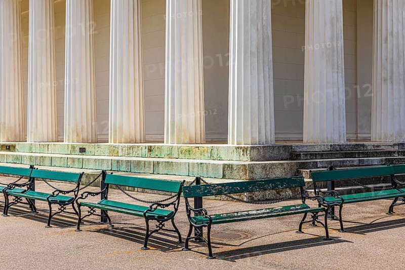 Columns of the Temple of Theseus, with green benches in front of it, Volksgarten, Vienna, Austria