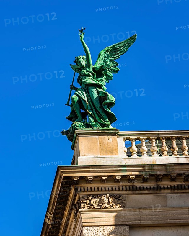 A bronze angel on the roof of the Kunsthistorisches Museum on Maria-Theresien-Platz, Vienna, Austria