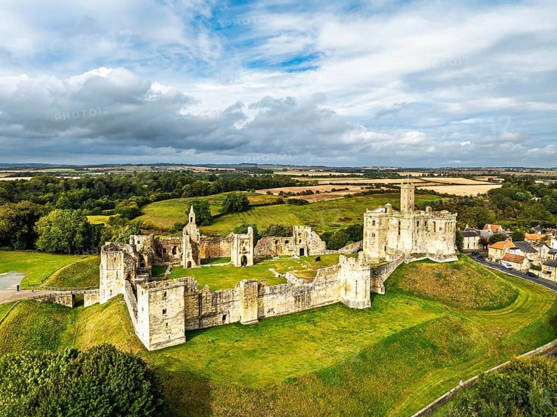 Warkworth Castle over River Coquet from a drone, Warkworth, Northumberland, England, United Kingdom