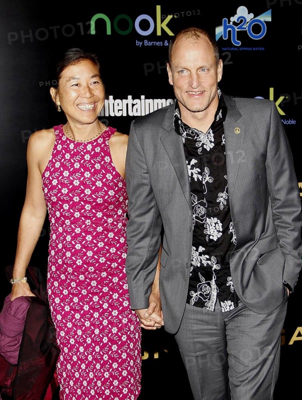 Woody Harrelson and Laura Louie at the Los Angeles premiere of 'The Hunger Games' held at the Nokia Theatre L.A. Live in Los Angeles on March 12, 2012, Los Angeles, CA, USA, Los Angeles, California, USA