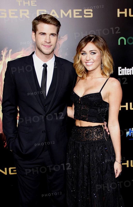 Liam Hemsworth and Miley Cyrus at the Los Angeles premiere of 'The Hunger Games' held at the Nokia Theatre L.A. Live in Los Angele, USAs on March 12, 2012, Los Angeles, CA, USA, Los Angeles, California, USA