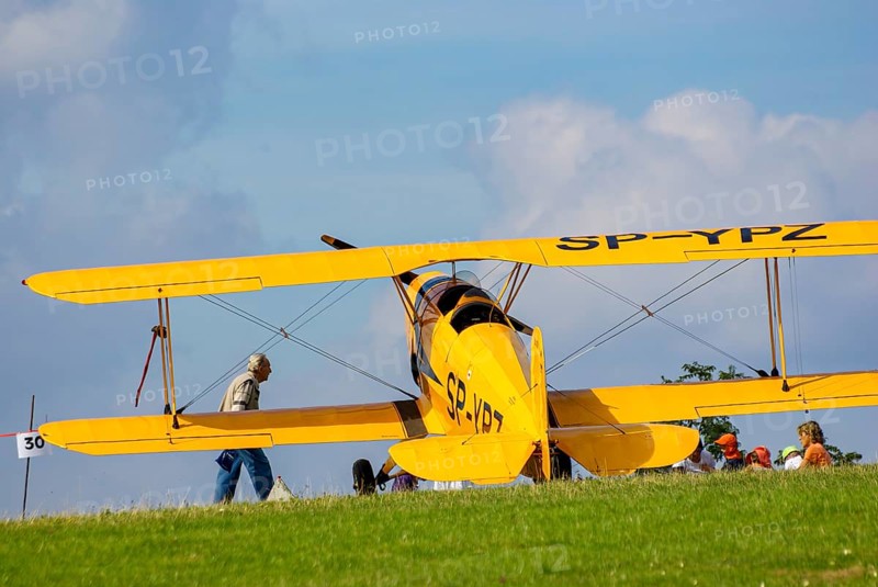 A Bücker Bü 131 Jungmann biplane parked at the edge of the airfield, SP-YPZ registration, as part of an air show on Rossfeld in Metzingen-Glems, Baden-Württemberg, Germany, for editorial use only