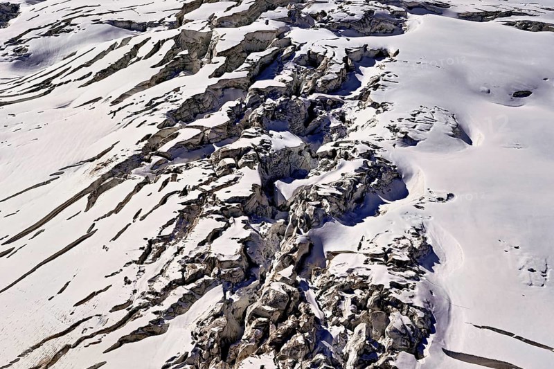 View from the Télécabine Panorama Railway of the glacial crevices of the Glacier du Géant, Chamonix-Mont-Blanc, Haute-Savoie, France