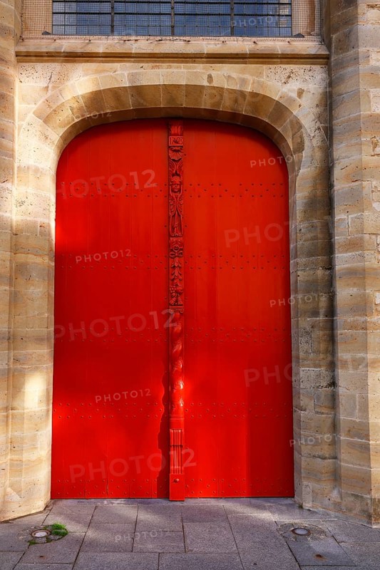 Historic St. Salvator Cathedral, Sint-Salvatorskathedraal, in the old town of Bruges, entrance, portal, red wooden door with decorative carvings and an angel figure, UNESCO World Heritage Site, Flanders, Belgium