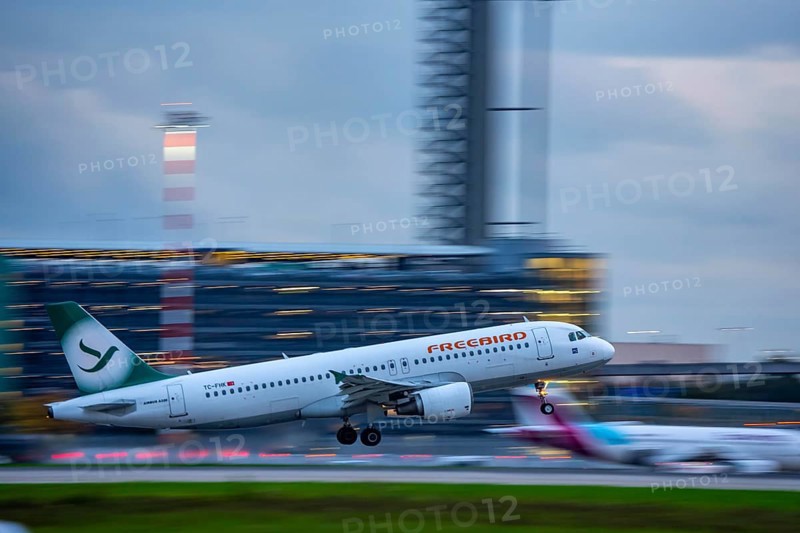 Freebird Airbus A320, taking off from Düsseldorf Airport, Air Traffic Control Tower, North Rhine-Westphalia, Germany