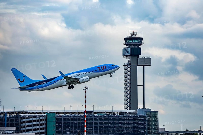 TUI Fly Boeing 737-800 taking off from Düsseldorf Airport, Air Traffic Control Tower, North Rhine-Westphalia, Germany